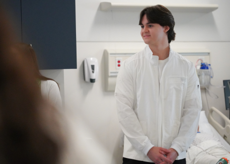 male student in healthcare course and lab coat