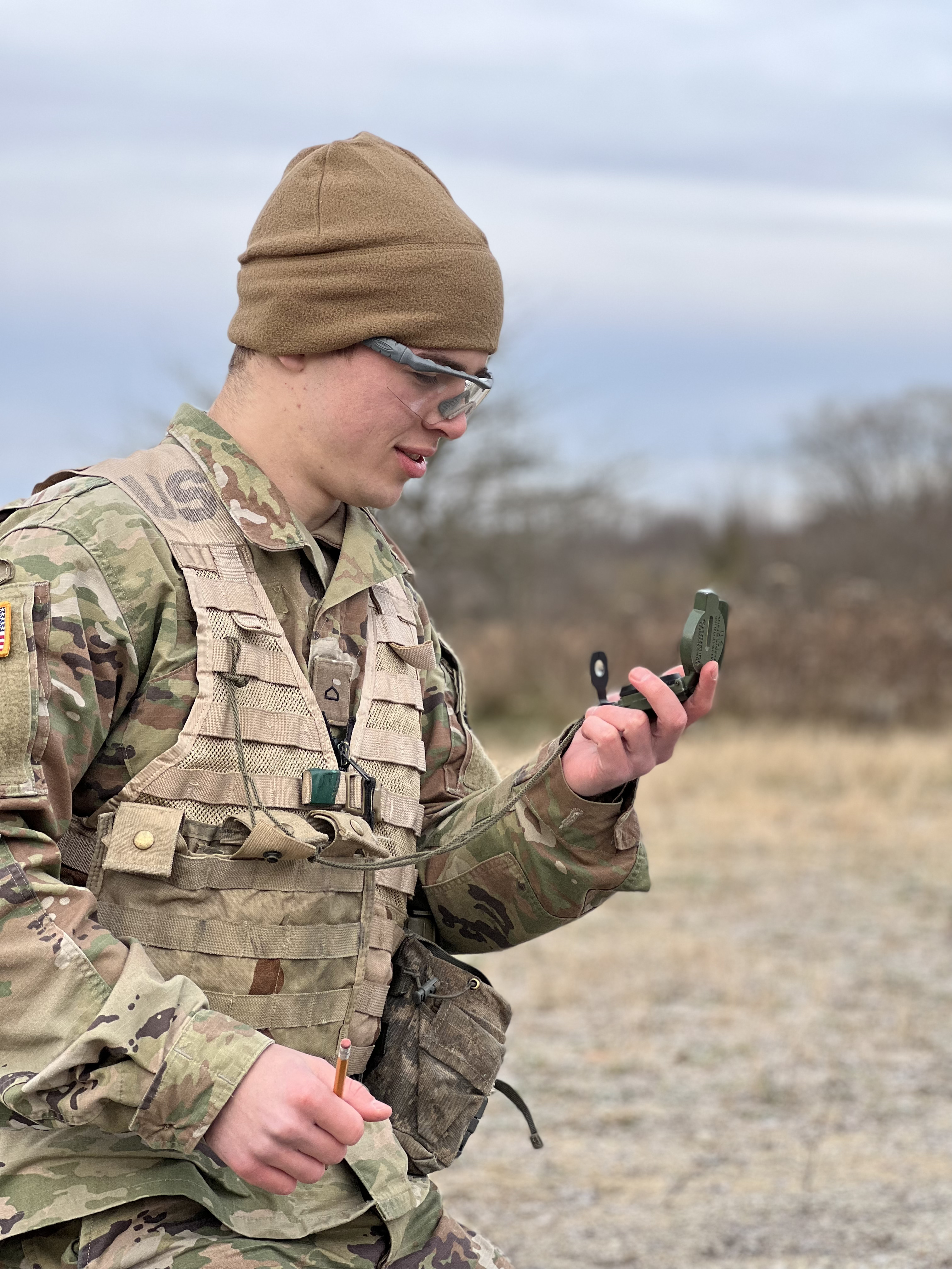 rotc student reading compass