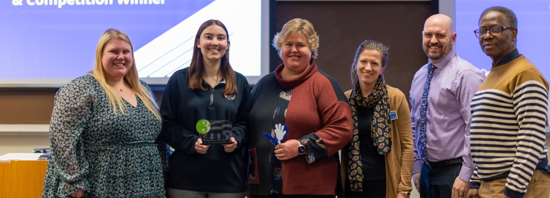 3MT Winner Peer Choice Winner Emily Davala with Competition Judges