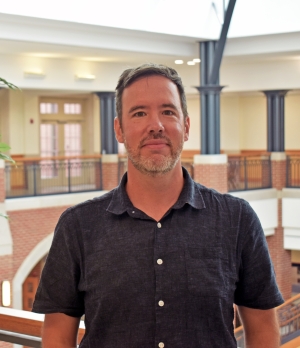 Watling stands in the Dolan Science Center