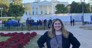 Olivia Shackleton standing in front of The White House.