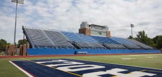 Photo of empty Don Shula football stadium and turf field.