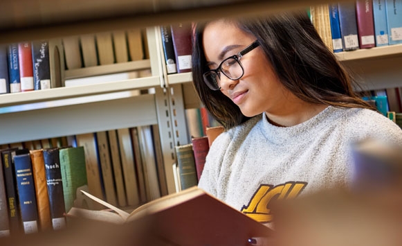 Female student studying in the library