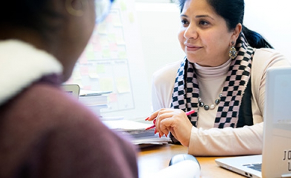 Female faculty member advising a female student 