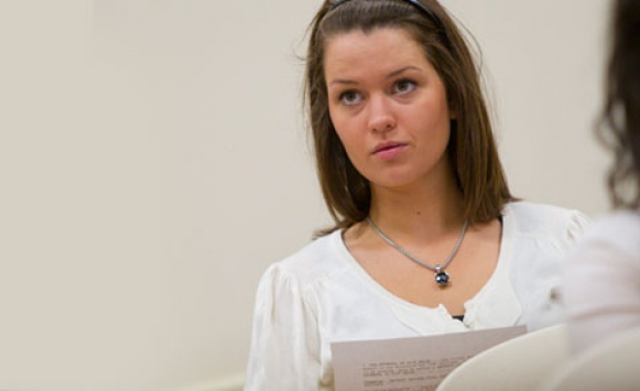 young girl reading in class 