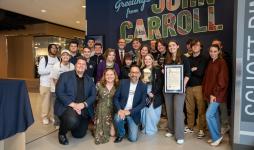 WJCU Radio Station team with trophy and ISBC representatives