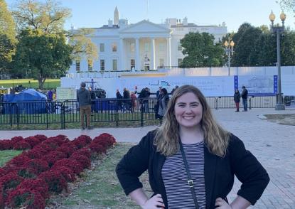 Olivia Shackleton standing in front of The White House.